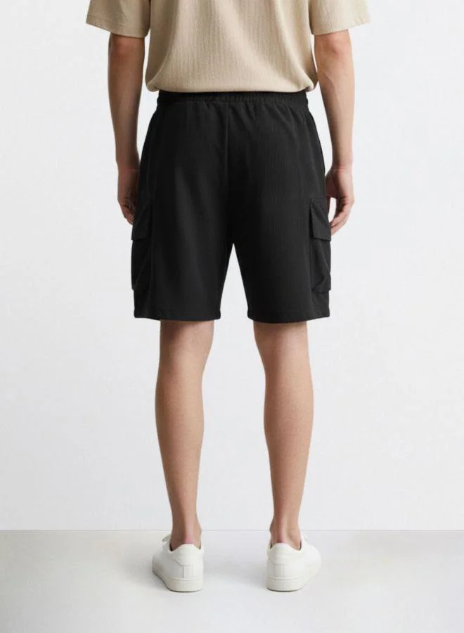 The Indian Garage Co Men Relaxed Fit Solid Cargo Pocket Mid-Rise Cargo Shorts